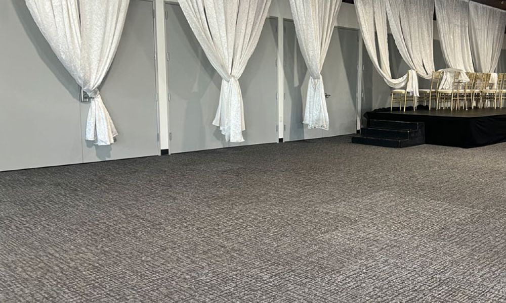 Professional cleaner vacuuming a carpet