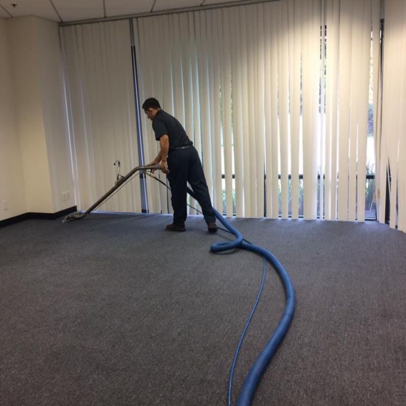 Man cleaning floor with buffer machine