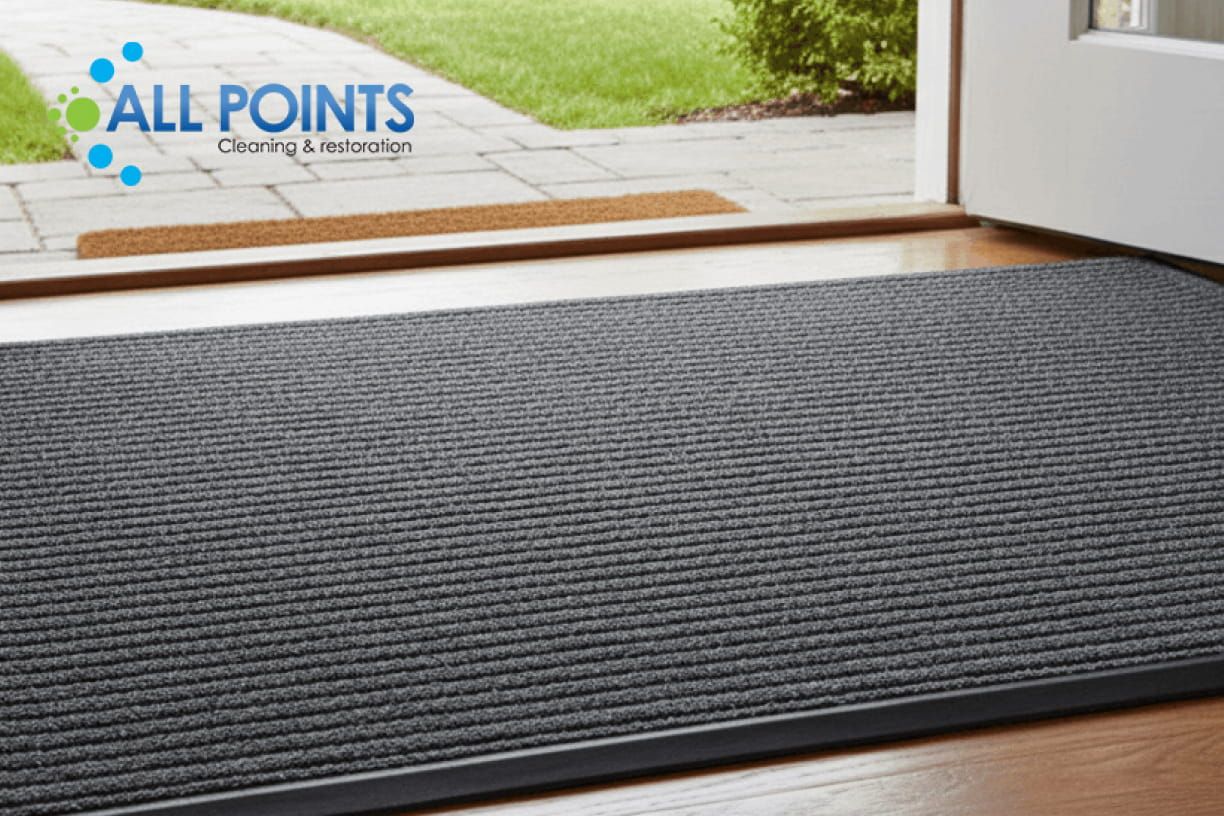 Worker inspecting attic insulation with a flashlight.
