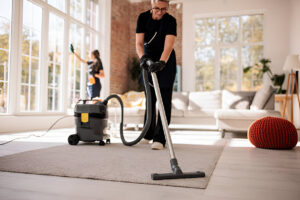 Cleaning Crew Tidying Large Apartment Interior